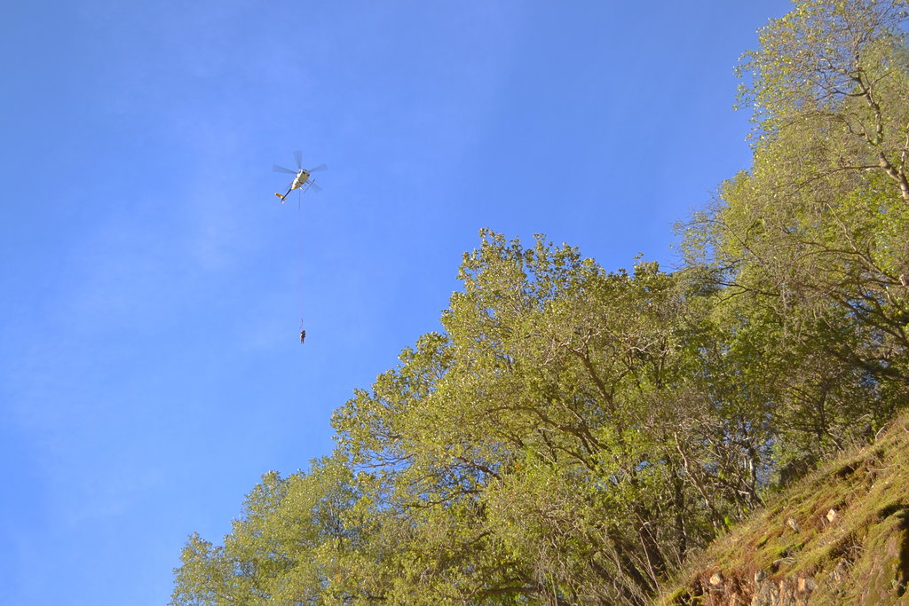 Man hanging from a helicopter