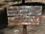 Mileage sign at the top of the Four Mile Trail