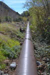 Pipe supplying water to hydroelectric plant on San Antonio Creek