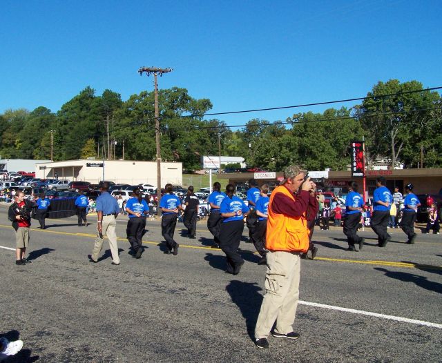 CBS cameraman filming at far left of photo.