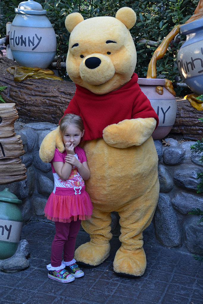 Ella poses with Pooh