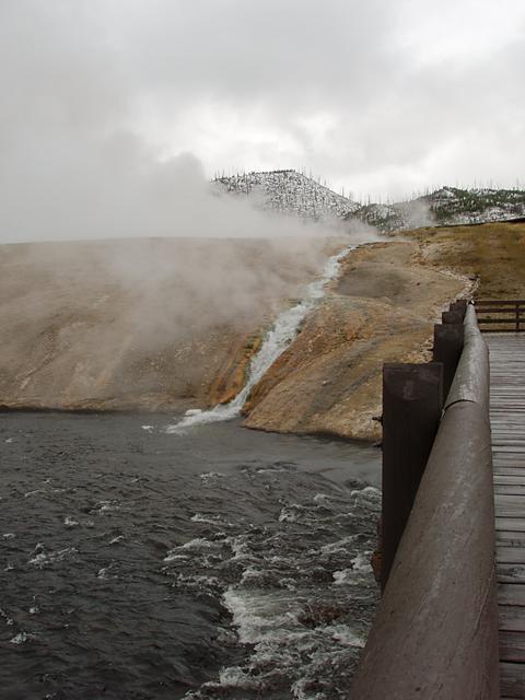 Excelsior Geyser pours over 4,000 gallons per minute into the Firehole River.